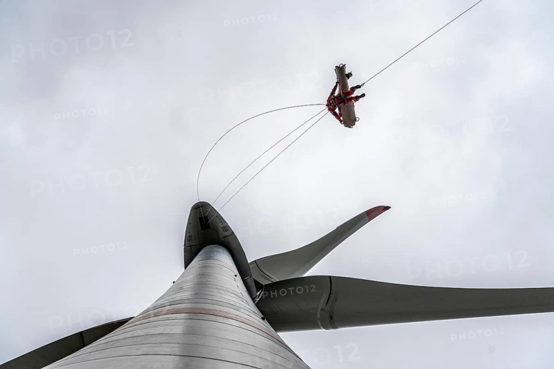 Height rescuers from the Oberhausen professional fire brigade practise abseiling from a wind turbine from a height of 150 metres, rescuing an injured person, technician, from the nacelle, Issum, North Rhine-Westphalia, Germany, Europe