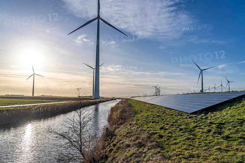 Solar park on the Slaperdijk dyke near the Eemshaven, test project, 17, 000 solar modules were installed over a good 5 kilometres, the Netherlands has over 22, 000 kilometres of dyke line, here it is being tested whether such an installation is successful and can be expanded, wind farm, Groningen, Netherlands