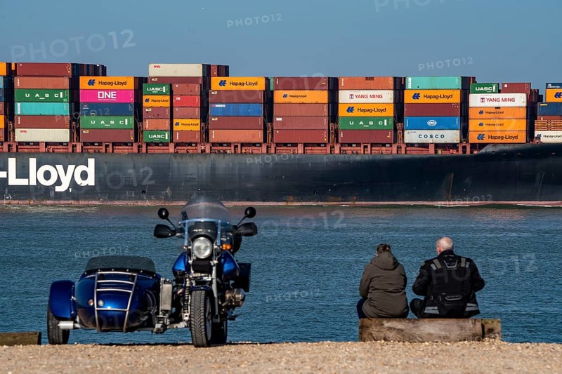 Container freighter Al Manamah, of the shipping company Hapag-Lloyd, in the harbour entrance of the deep-sea port Maasvlakte 2, the seaport of Rotterdam, Netherlands, on an artificial land area off the original coast, spotter