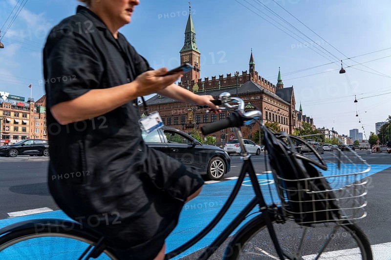 Cyclists on cycle paths, Radhuspladsen, City Hall Square, in the city centre of Copenhagen, considered the cycling capital of the world, 45 % of the inhabitants travel by bike, Denmark, Europe