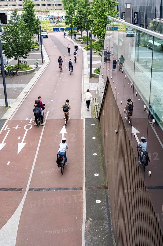 Entrance and exit of the bicycle car park at Utrecht Centraal station, Stationsplein, over 13, 000 parking spaces, considered the largest bicycle car park in the world, over 3 underground floors, Utrecht, Netherlands