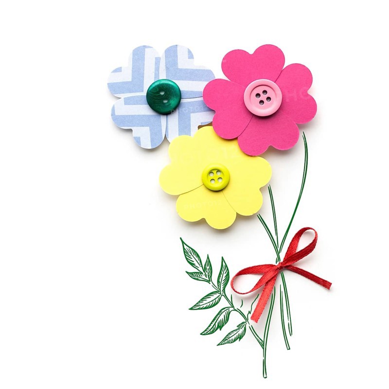 Creative valentines concept photo of a flower made of paper hearts with buttons on white background