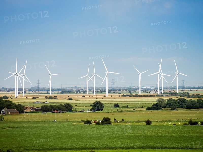 An image of some modern wind energy in the scenery