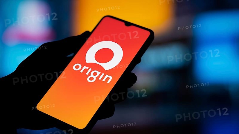 Origin Energy logo is displayed on smartphone. Origin Energy Ltd is an Australian energy company that generates, retails, and distributes electricity and natural gas