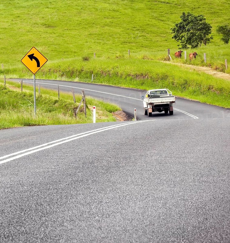 A photography of a road sign curve