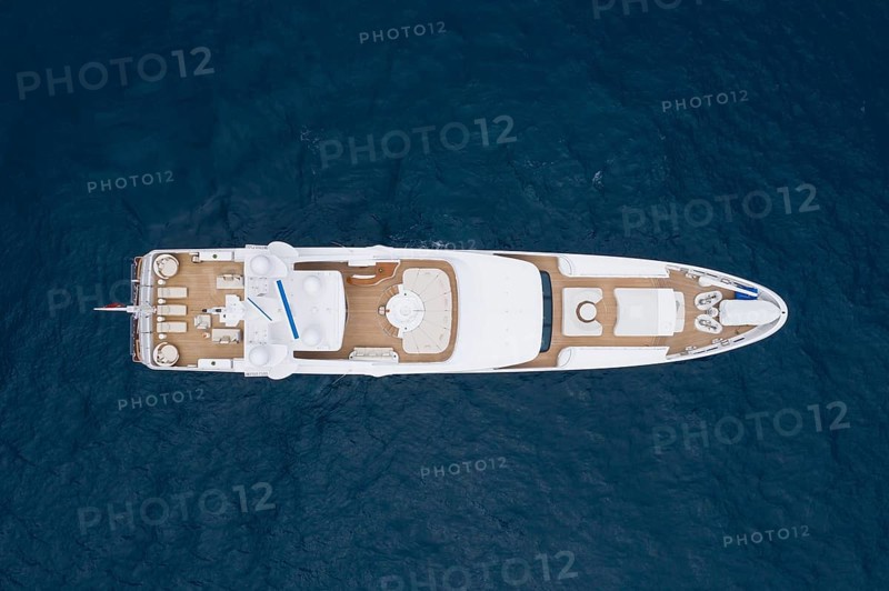 Aerial view motor yacht in front of the Principality of Monaco, French Riviera, Mediterranean Sea