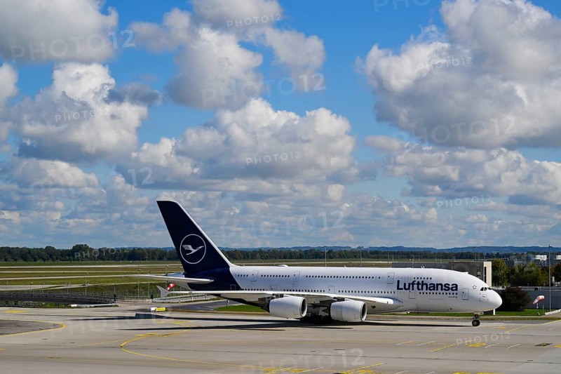 Lufthansa Airbus A380-800 taxiing under blue sky from Runway North on Apron 2 East to Terminal 2, Satellite, Terminal 2, Munich Airport, Upper Bavaria, Bavaria, Germany, Europe