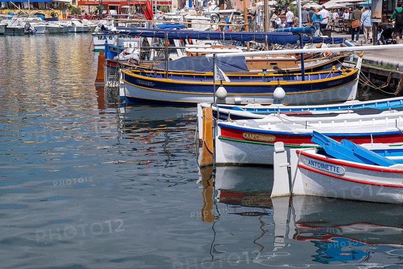 Small colourful boats in the harbour, reflected in the calm water, harbour of Cassis, Provence, Provence-Alpes-Cote d'Azur, South of France, France, Europe