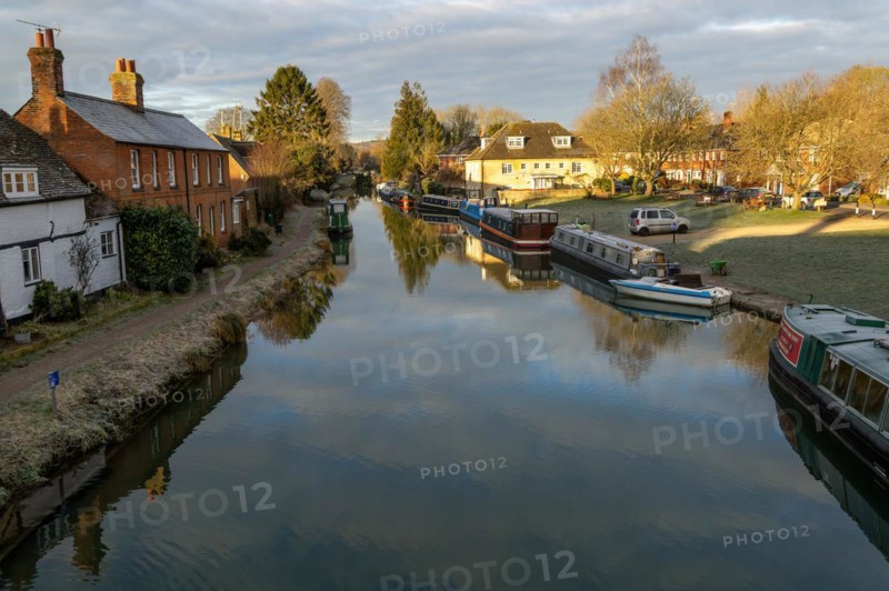 Narrow boats moored on Kennet and Avon canal in town centre of Hungerford, Berkshire, England, UK