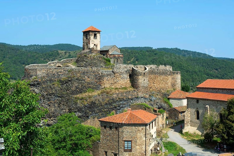 Medieval castle perched on a volcanic peak in Saint-Ilpize overlooking the Haut-Allier valley, Haute-Loire, Auvergne-Rhone-Alpes, France, Europe