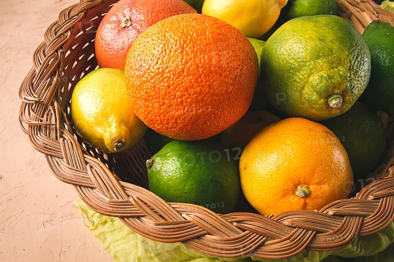 Assortment, citrus fruits, in a basket, close-up, top view, no people