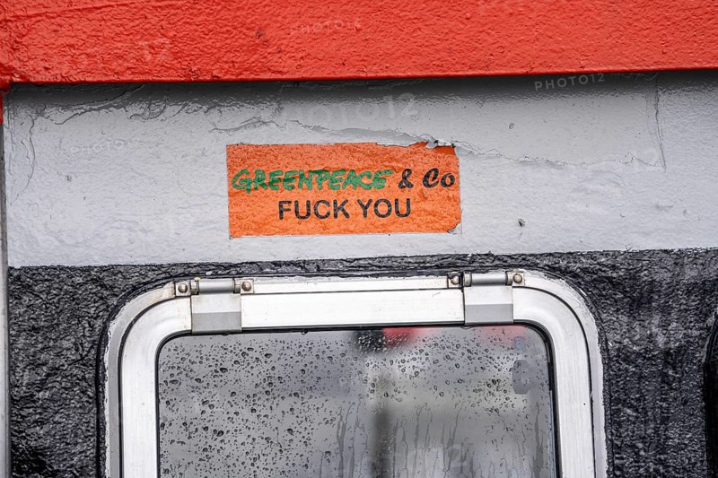 Protest against environmental groups such as Greenpeace, sticker on a fishing boat, in the city harbour of Sassnitz, island of Rügen, Mecklenburg-Western Pomerania, Germany, Europe