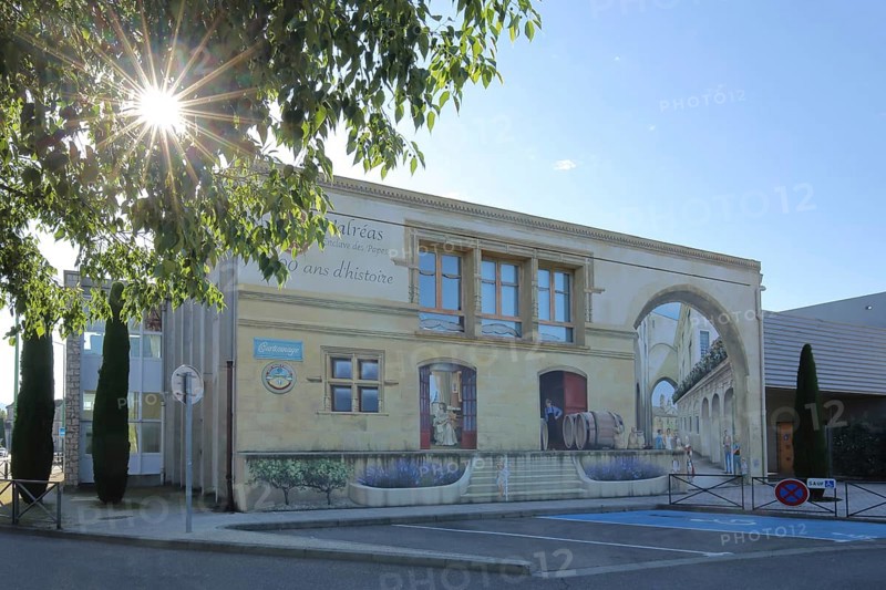 Mural by artist group 7e Sens, 2021 with historical city history, street art, mock architecture, mock painting, former railway station backlit, Valréas, Valreas, Vaucluse, Provence, France, Europe
