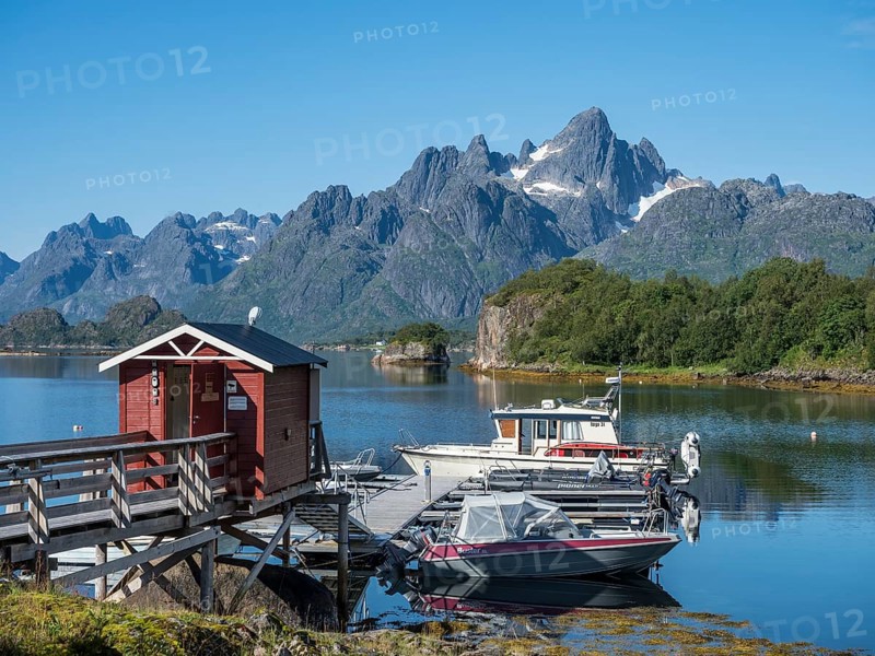 Little marina at the Tennfjord, branch of Raftfjord visible in the back, Raftsund, the waterway between Lofoten and Vesteralen island, Norway, Europe