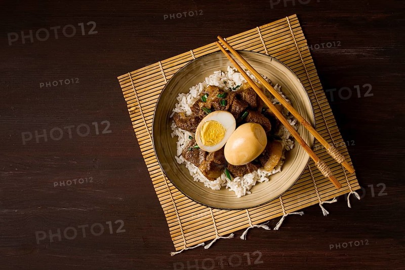 Stewed eggs, with pork belly, and rice, chinese food, homemade, selective focus, rustic, no people