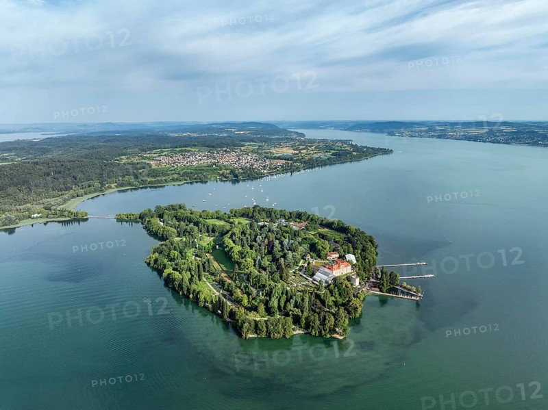 The island of Mainau in Lake Constance with the jetty and the baroque Mainau Castle, built between 1739 and 1746, on the horizon the Bodanrück, in front of it the village of Litzelstetten, aerial view, Constance district, Baden-Württemberg, Germany, Europe