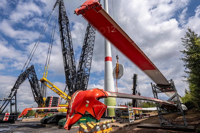 Erection of a wind turbine, wind energy plant, assembly of the ring generator, with a crawler lattice crane, wind farm near Hagen, North Rhine-Westphalia, Germany, Europe