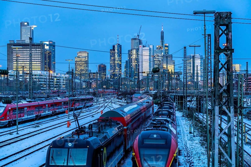 Railway tracks in front of the main railway station in Frankfurt am Main, skyline of skyscrapers in the Cit, winter, snow, dusk, Hesse, North Rhine-Westphalia