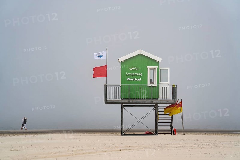 North Sea island of Langeoog, early summer, shortly after the first easing of the lockdown in the Corona crisis, foggy weather, still quite few tourists on the beach, DLRG watchtower, Lower Saxony, Germany, Europe