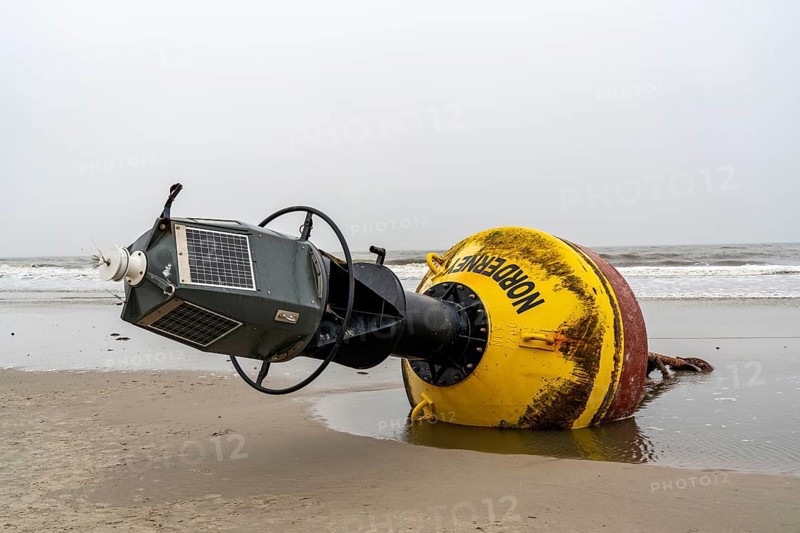 Washed up buoy, sea mark, detached in a storm, originally off the island of Norderney in the North Sea, Wadden Sea World Heritage Site, North Sea island of Spiekeroog, East Frisian North Sea coast, at low tide