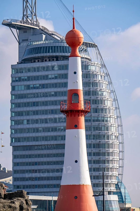 Skyline of Bremerhaven, Atlantic Sail City Hotel skyscraper, front light Bremerhaven, a red and white striped lighthouse, at Willy-Brandt-Platz, at the Seebäderkaje Bremen, Germany, Europe