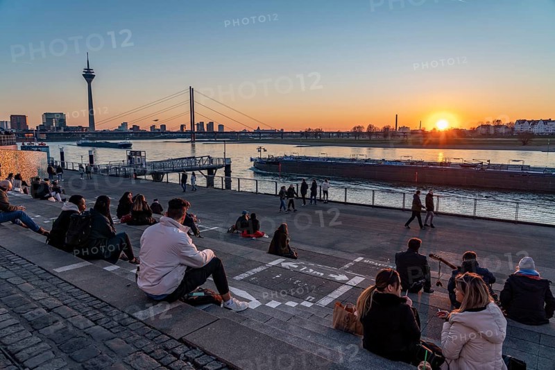 Rhine promenade, Rhine bank at the old town of Düsseldorf, stairs at the castle tower, Rheinkniebrücke, Rhine tower, spring, sunset, North Rhine-Westphalia, Germany, Europe