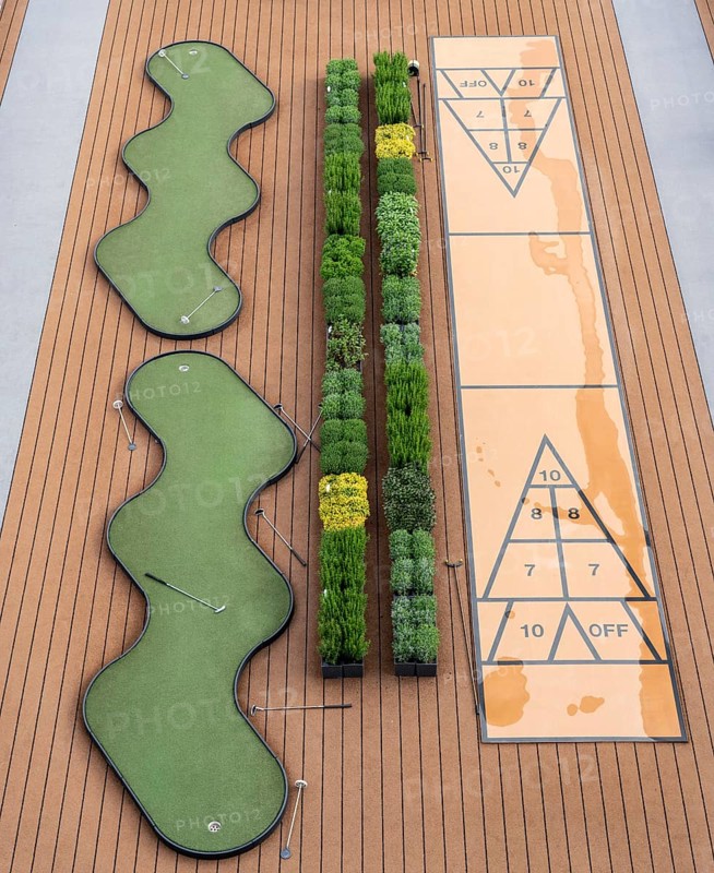 Outdoor deck, upper deck, open-air deck of a river cruise ship, putting green and shuffleboard game on deck