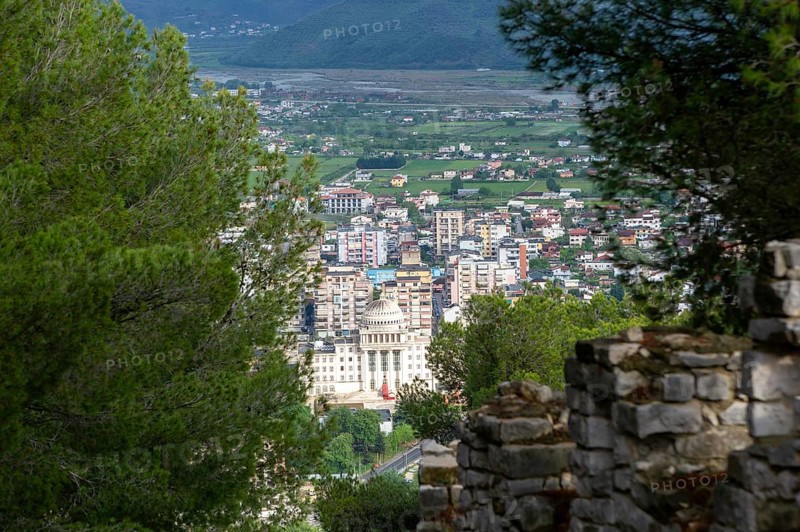 Raised view through trees over city of Berat, Albania, Europe