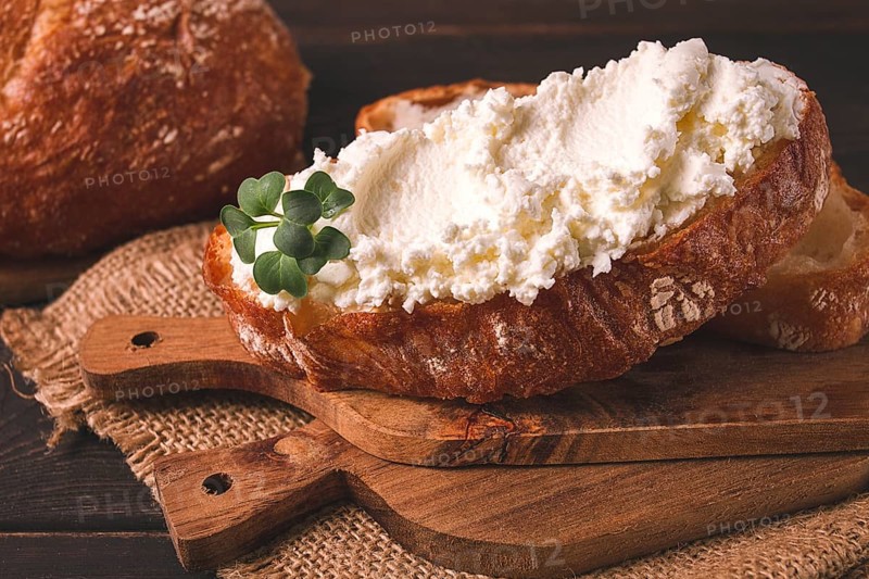 Sandwich, with cream cheese, homemade, on a cutting board, rustic style, no people, selective focus, breakfast