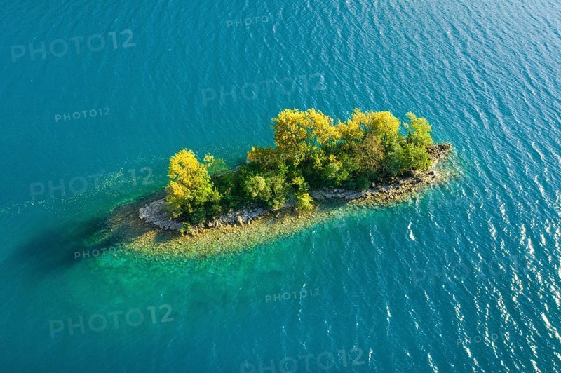 Bird's eye view of the chive island in the turquoise waters of Lake Walen in the canton of St. Gallen, Switzerland, Europe