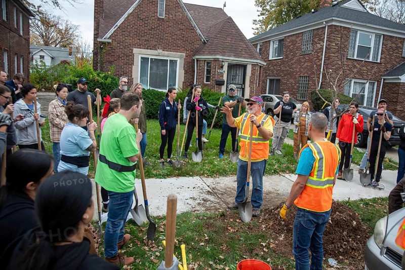 Detroit, Michigan, The nonprofit Greening of Detroit plants trees in the Morningside neighborhood. The work was done by volunteers, who listened to instructions before beginning the job