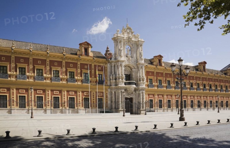 San Telmo palace building facade with columns at the entrance decorated with carved statues and sculptures, Seville, Spain, Europe