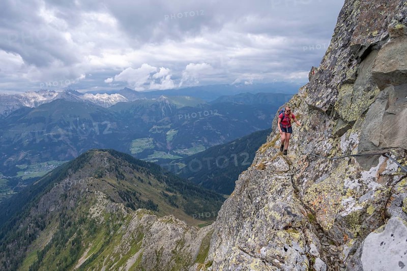 Hiker on the Carnic High Trail, ascent to the Raudenspitze, Carnic Main Ridge, Carnic Alps, Carinthia, Austria, Europe
