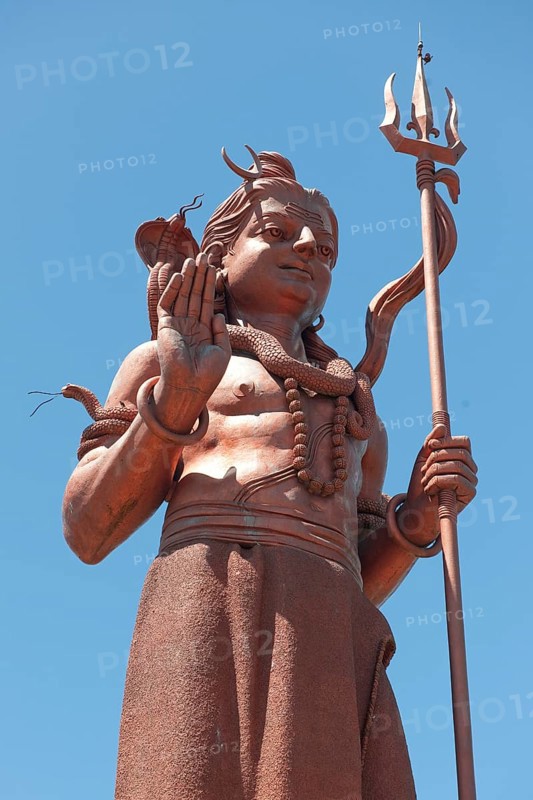 Photo from street level upward view of larger-than-life figure of god deity of Hindi Hindu statue large sculpture large sculpture of Hindu religion Hinduism Lord Shiva, Ganga Talao, Le Pétrin, Mauritius, Africa