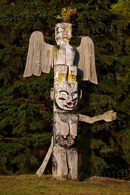Kwakwakawakw totem pole at the cemetery in Alert Bay, Cormorant Island, British Columba, Canada, North America