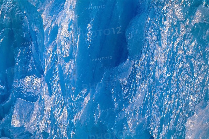 Ice wall in turquoise color with sun reflections on a glacier in arctic, Spitsbergen, Svalbard, Norway, Europe