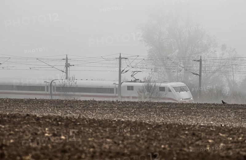 A Deutsche Bahn ICE train runs in foggy autumn weather on a railway line near Neugarten, 06.11.2024, Neugarten, Brandenburg, Germany, Europe