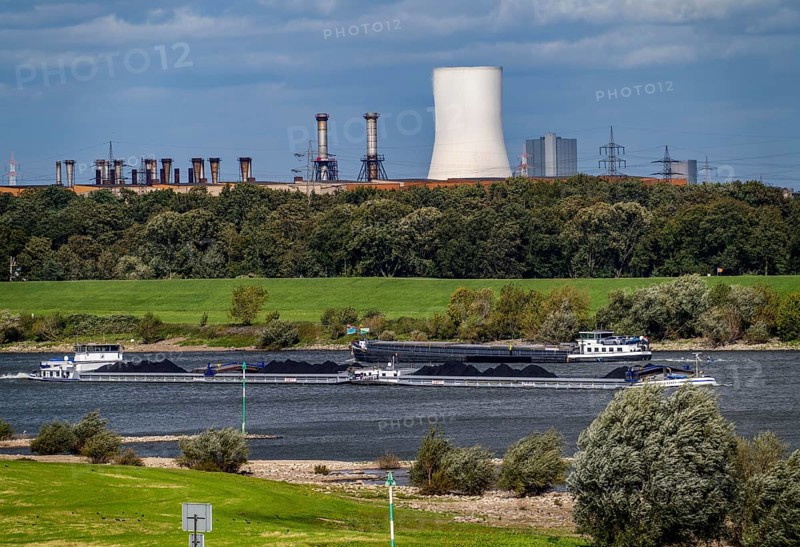 Rhine at Duisburg-Beeckerwerth, freighter loaded with coal, cooling tower, of the STEAG coal-fired power plant Walsum, hot strip mill II, industrial scenery of the ThyssenKrupp Steel steelworks in Bruckhausen, North Rhine-Westphalia, Germany, Europe