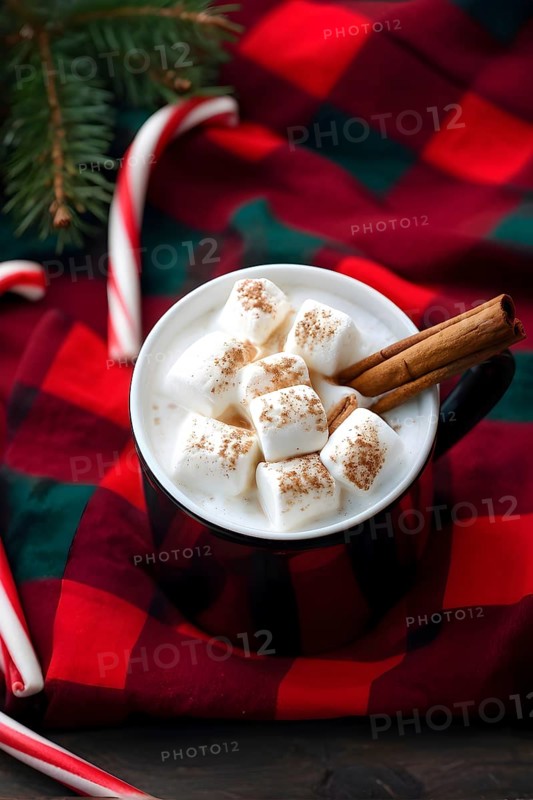 A close-up of a steaming cup of hot cocoa topped with marshmallows, surrounded by cinnamon sticks, candy canes, and a plaid blanket, evoking a warm, festive feel, AI generated