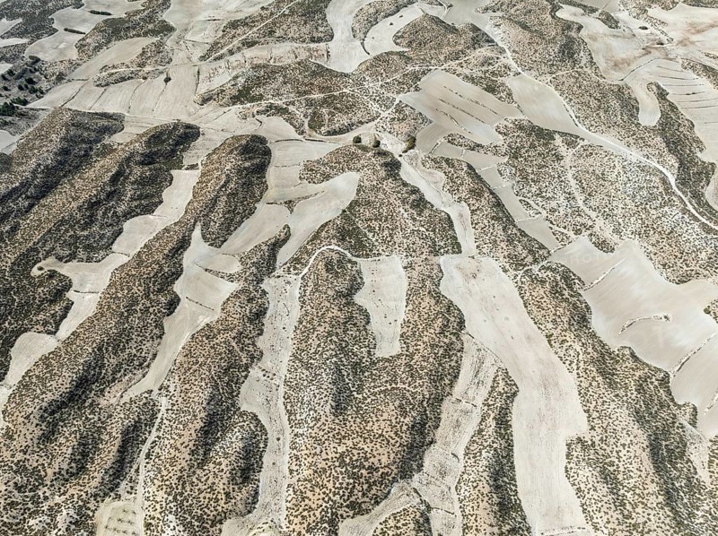 Farmland amongst rocky outcrops. Aerial view. Drone shot. Granada province, Andalusia, Spain, Europe