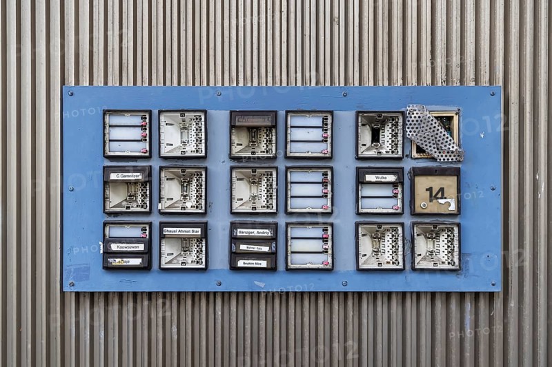 Doorbell sign, broken letterbox system on a dilapidated block of flats in Stuttgart, Baden-Württemberg, Germany, Europe