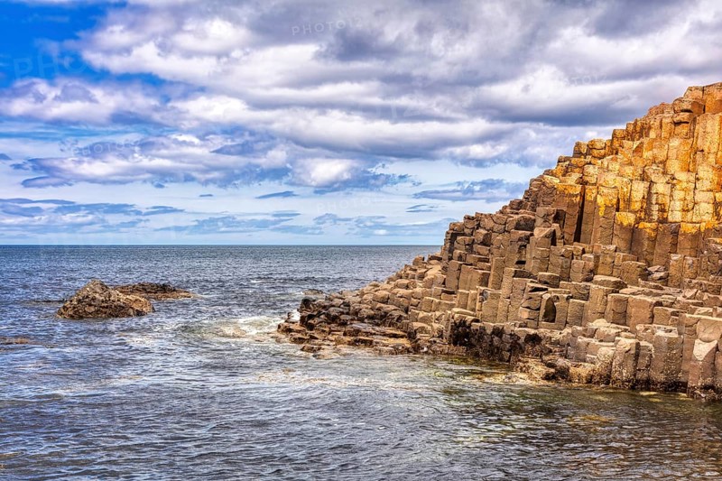 Basaltic rocks on a coastline under dramatic skies, Giant Causeway