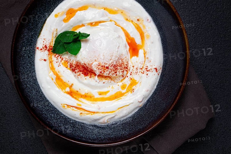 Cilbir, traditional Turkish breakfast, Turkish eggs with yogurt and butter, homemade, no people