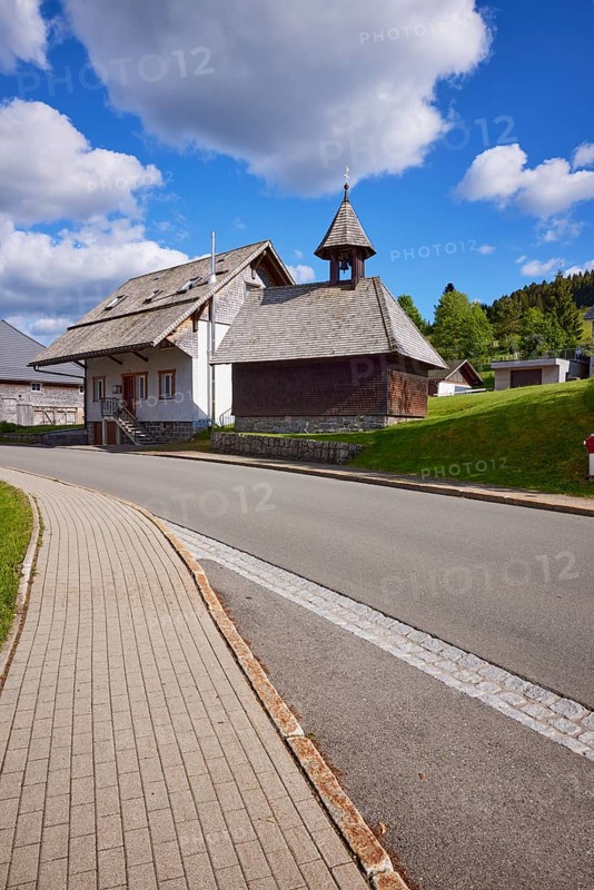 Chapel Unterlehen with road under blue sky with cumulus clouds in Bernau im Black Forest, Black Forest, District Waldshut, Baden-Württemberg, Germany, Europe