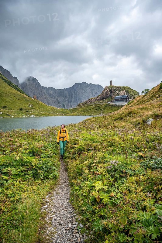 Wolayersee and Wolayerseehütte, hiker on the Carnic High Trail, Carnic Alps, Carnic Alps main ridge, Austria, Europe
