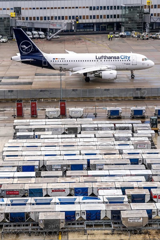Düsseldorf Airport, Unit Load Devices, ULD, containers for baggage and freight for narrow-body and wide-body aircraft, baggage and freight are pre-packed in here and can then be quickly loaded or unloaded onto the aircraft, Lufthansa City aircraft on the apron, at Terminal A, Düsseldorf, North Rhine-Westphalia, Germany, Europe
