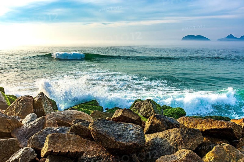 Waves crashing against the breakwater at Barra da Tijuca beach in Rio de Janeiro at dawn Rio de Janeiro, Barra da Tijuca, RJ, Brazil, South America