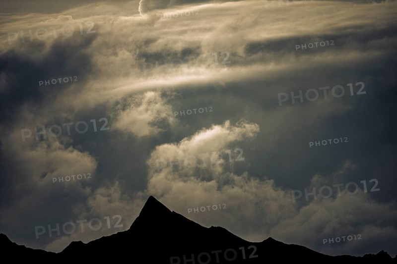 Summit in the morning light with dramatic clouds, Lech, Lechquellengebirge, Vorarlberg, Austria, Europe