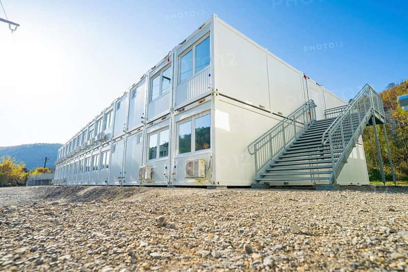 Container building with stairs, graphic lines in front of blue sky and nature, refugee accommodation Beermiß, Calmbach, Black Forest, Germany, Europe