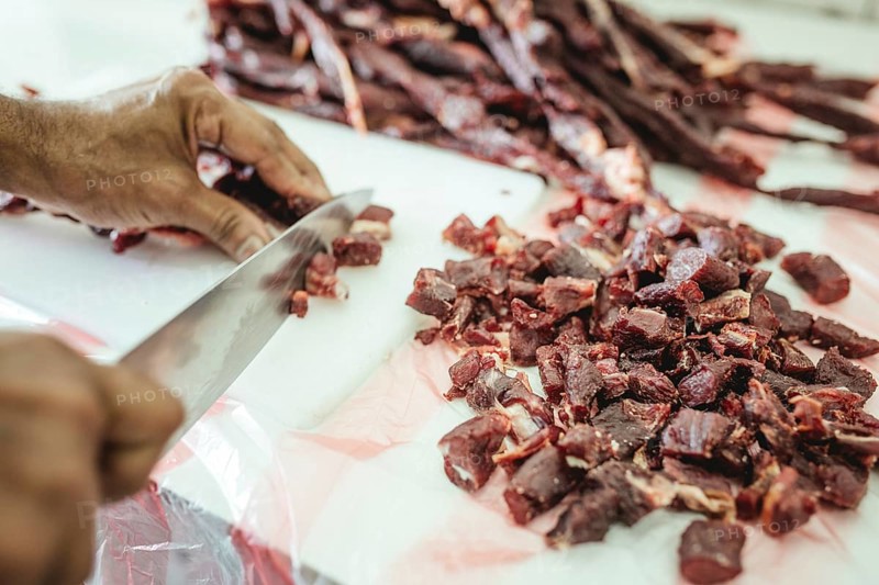 Dried camel meat is cut into pieces, camel restaurant and camel butchery on the state road from Salalah to Muscat near Wadi Hanun, Dhofar, Oman, Asia
